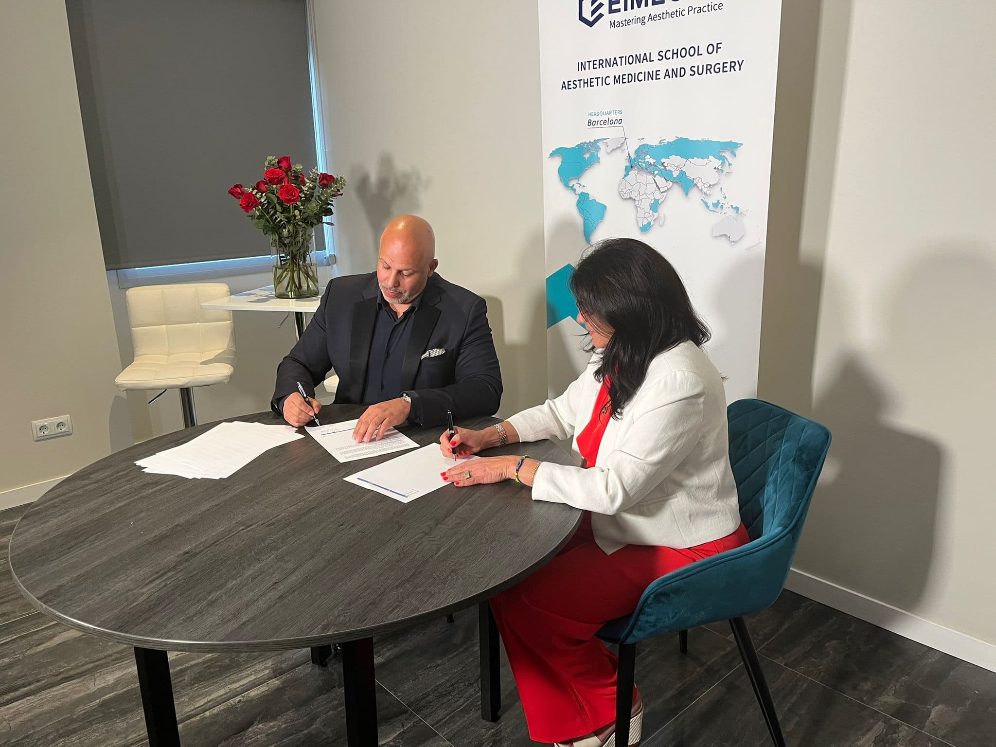 Haron Hasni and Dr. Zainela Laborde signing the EIMEC × H5 AI Academy partnership